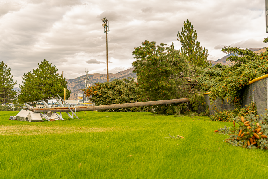 Severe storm damage to exterior residential electrical service mast and meter enclosure Severe storm damage to exterior residential electrical service mast and meter enclosure